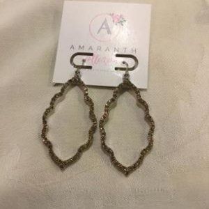 Sparkly bronze colored pierced earrings.